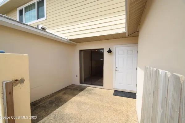 a view of a pathway along with potted plants