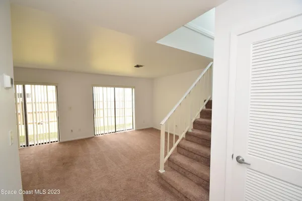 a white toilet sitting next to a shower
