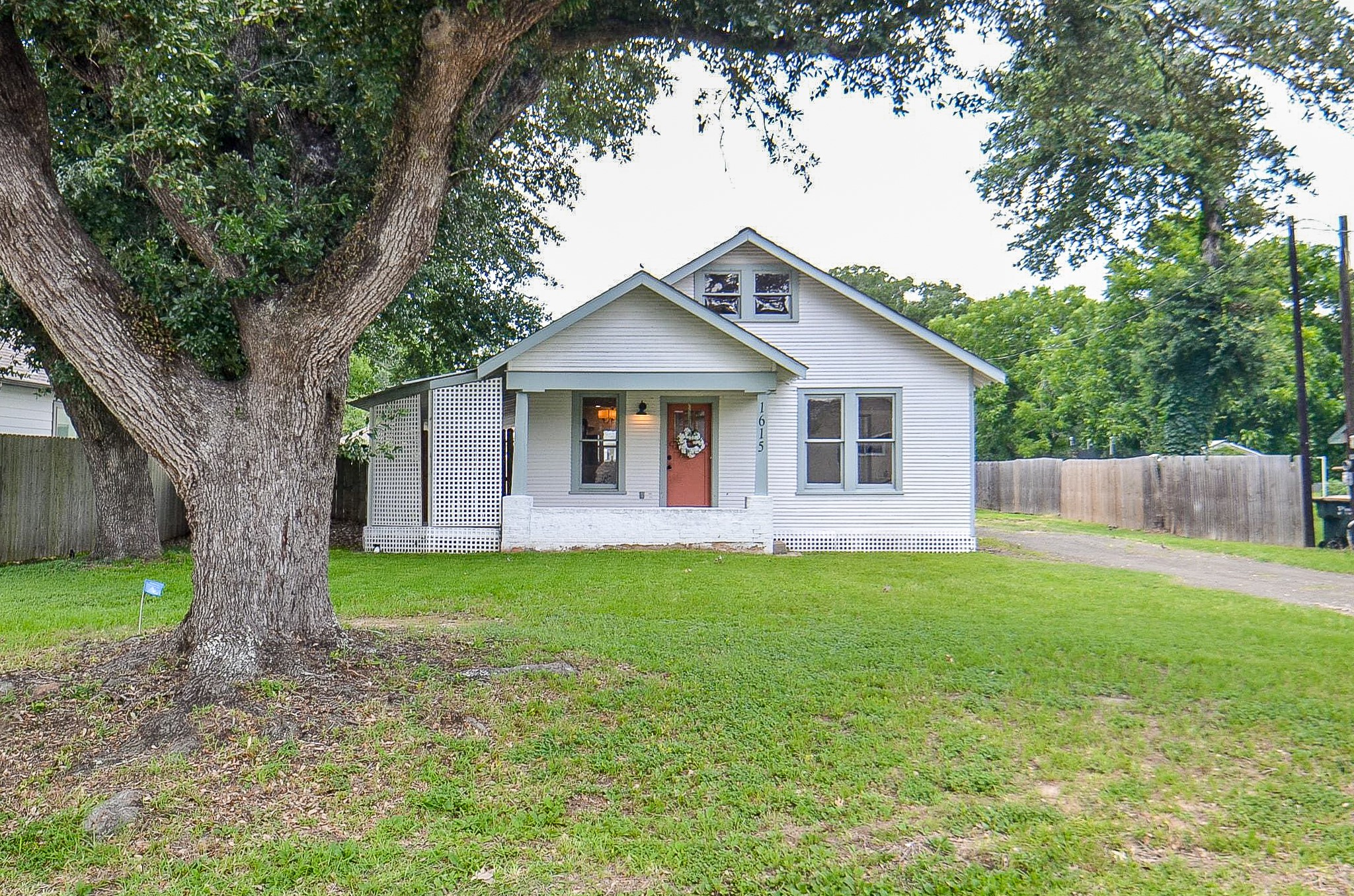 Charming 1.5 story Craftsman style home nestled on an oversized lot in the heart of Sealy!