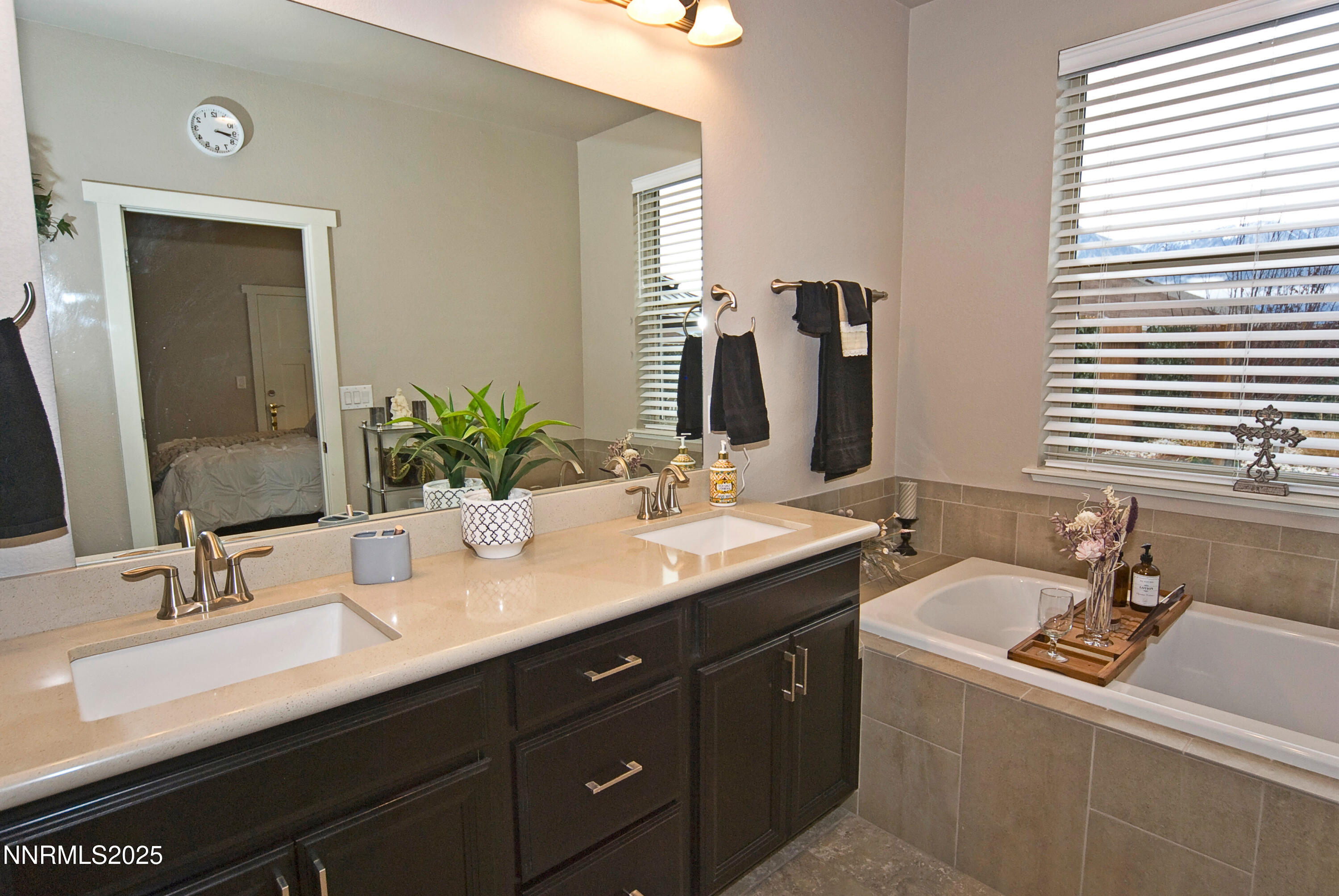 768 East Cottage Loop Gardnerville, NV 89460 - Photo 15 of 23 a bathroom with a sink double vanity and a mirror