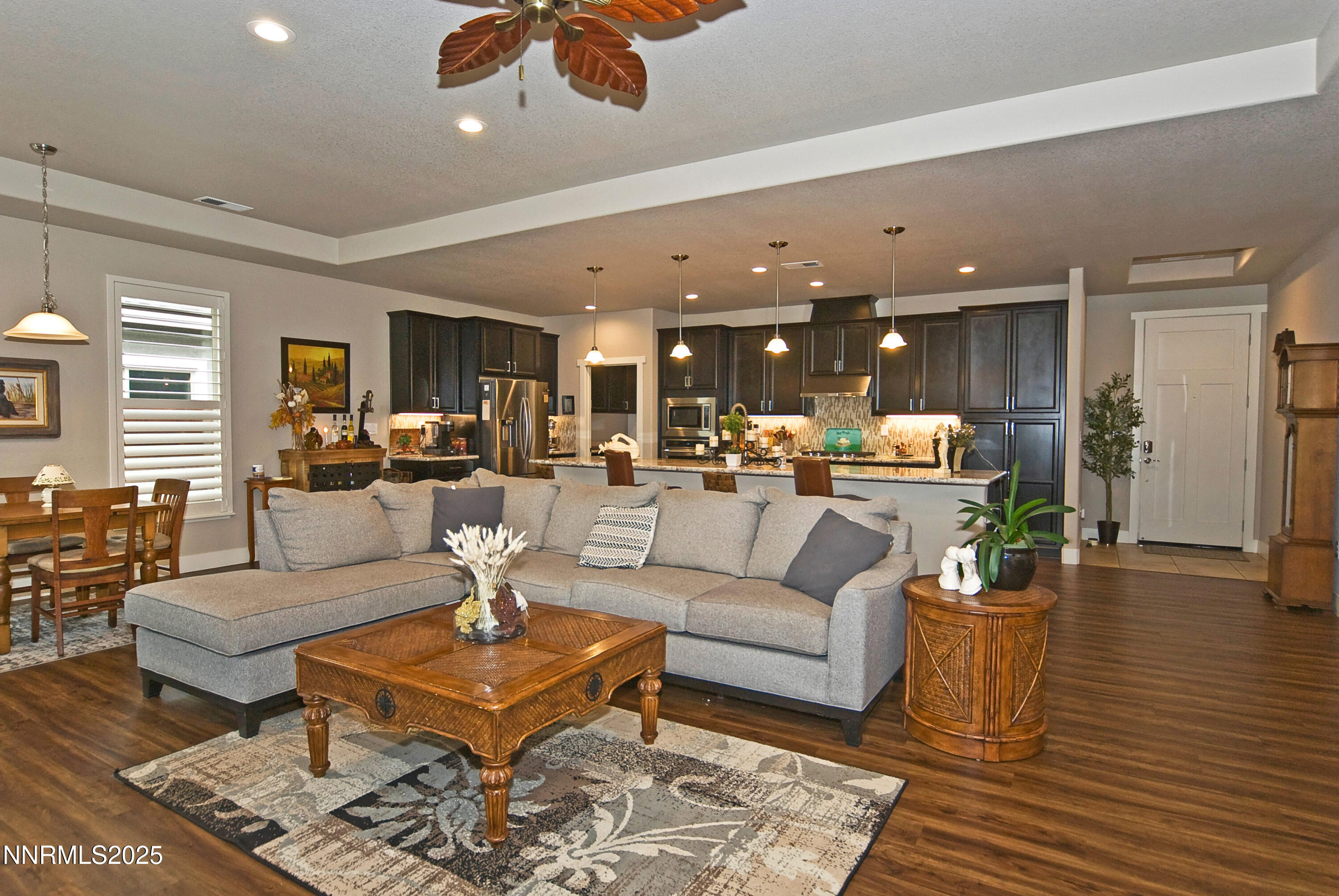 768 East Cottage Loop Gardnerville, NV 89460 - Photo 3 of 23 a living room with furniture kitchen view and a wooden floor