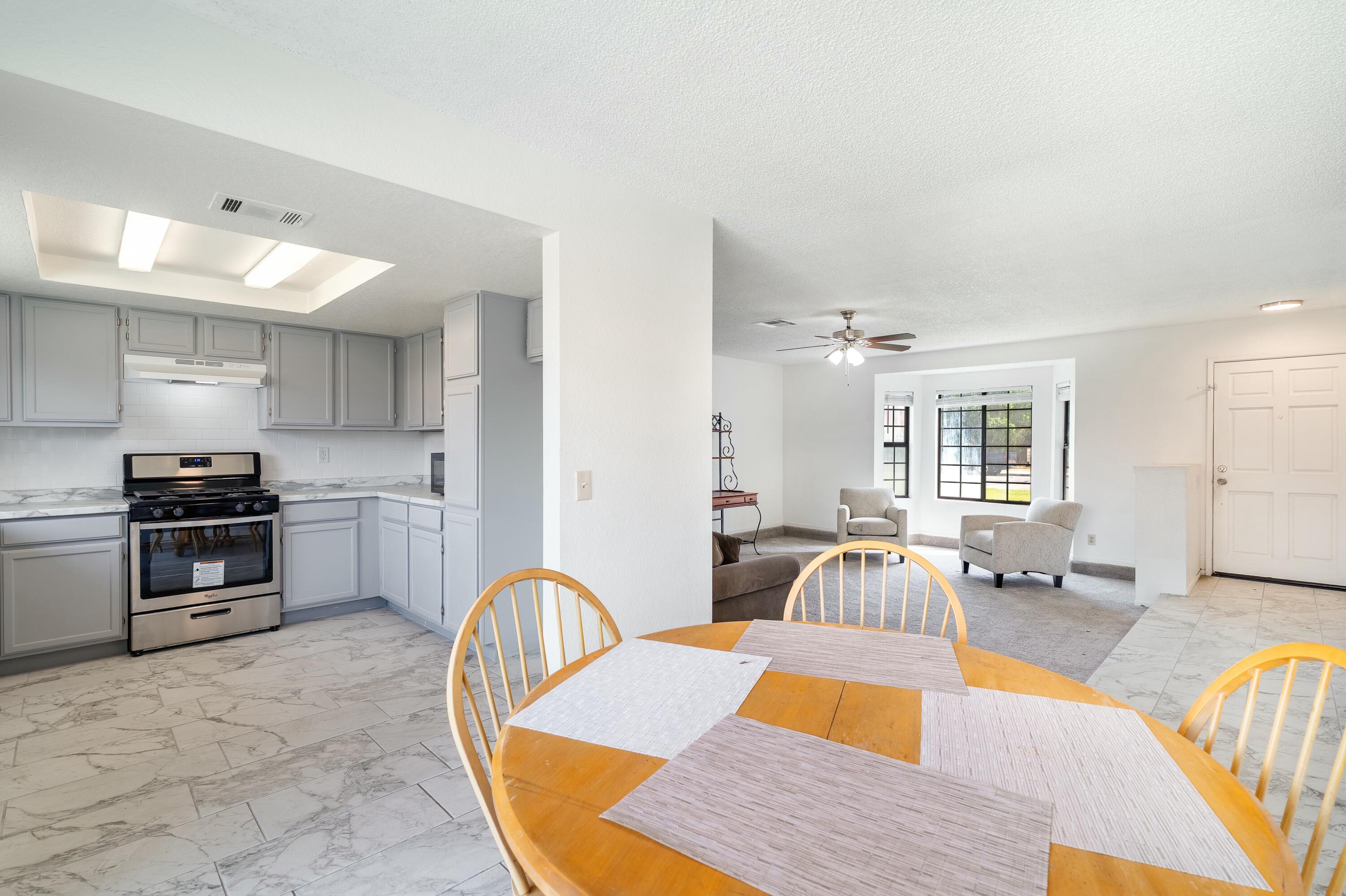 69290 El Dobe Road Cathedral City, CA 92234 - Photo 11 of 42 a living room with furniture fireplace and wooden floor