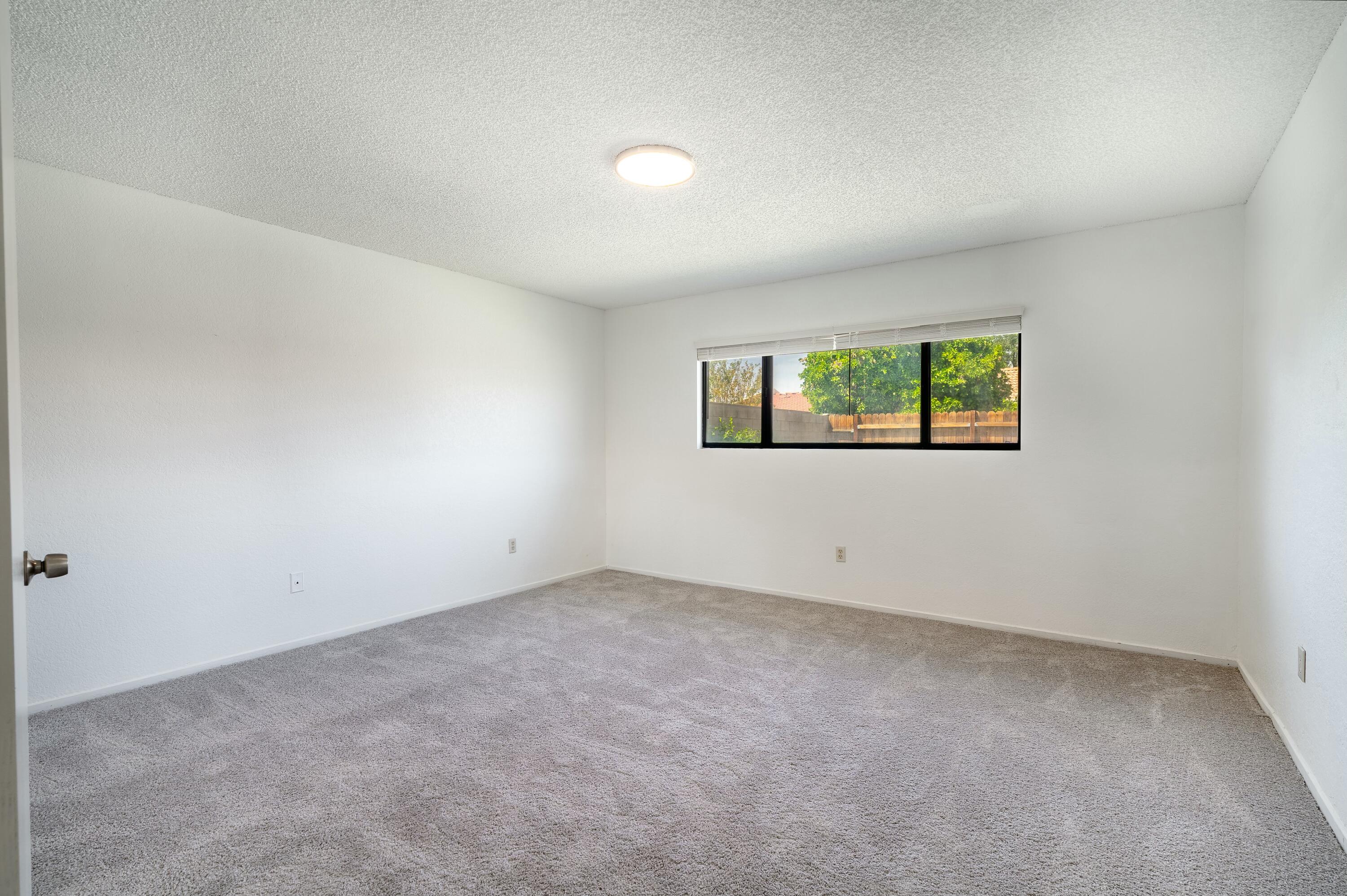 69290 El Dobe Road Cathedral City, CA 92234 - Photo 22 of 42 an empty room with windows