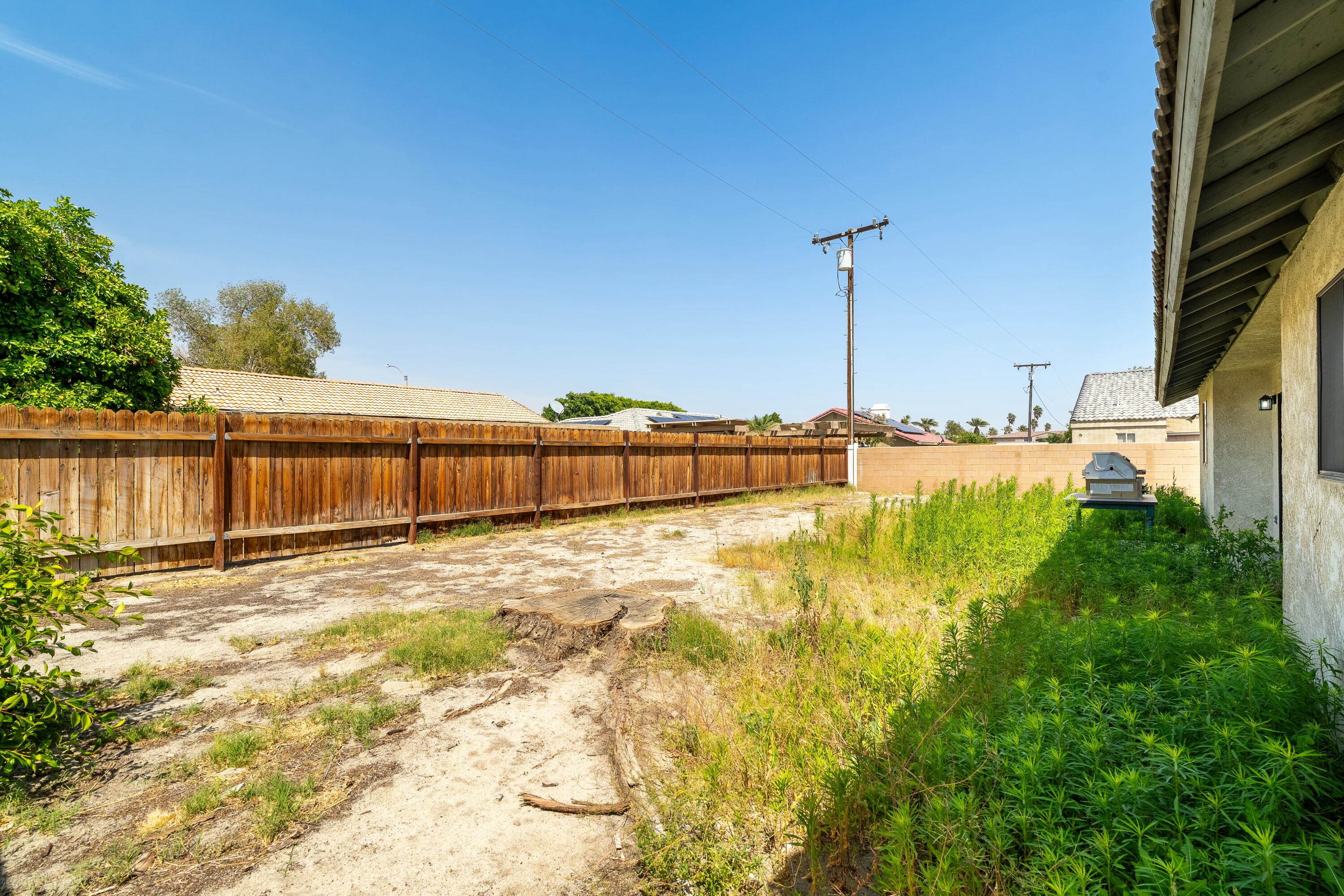 69290 El Dobe Road Cathedral City, CA 92234 - Photo 28 of 42 a view of a swimming pool with a yard