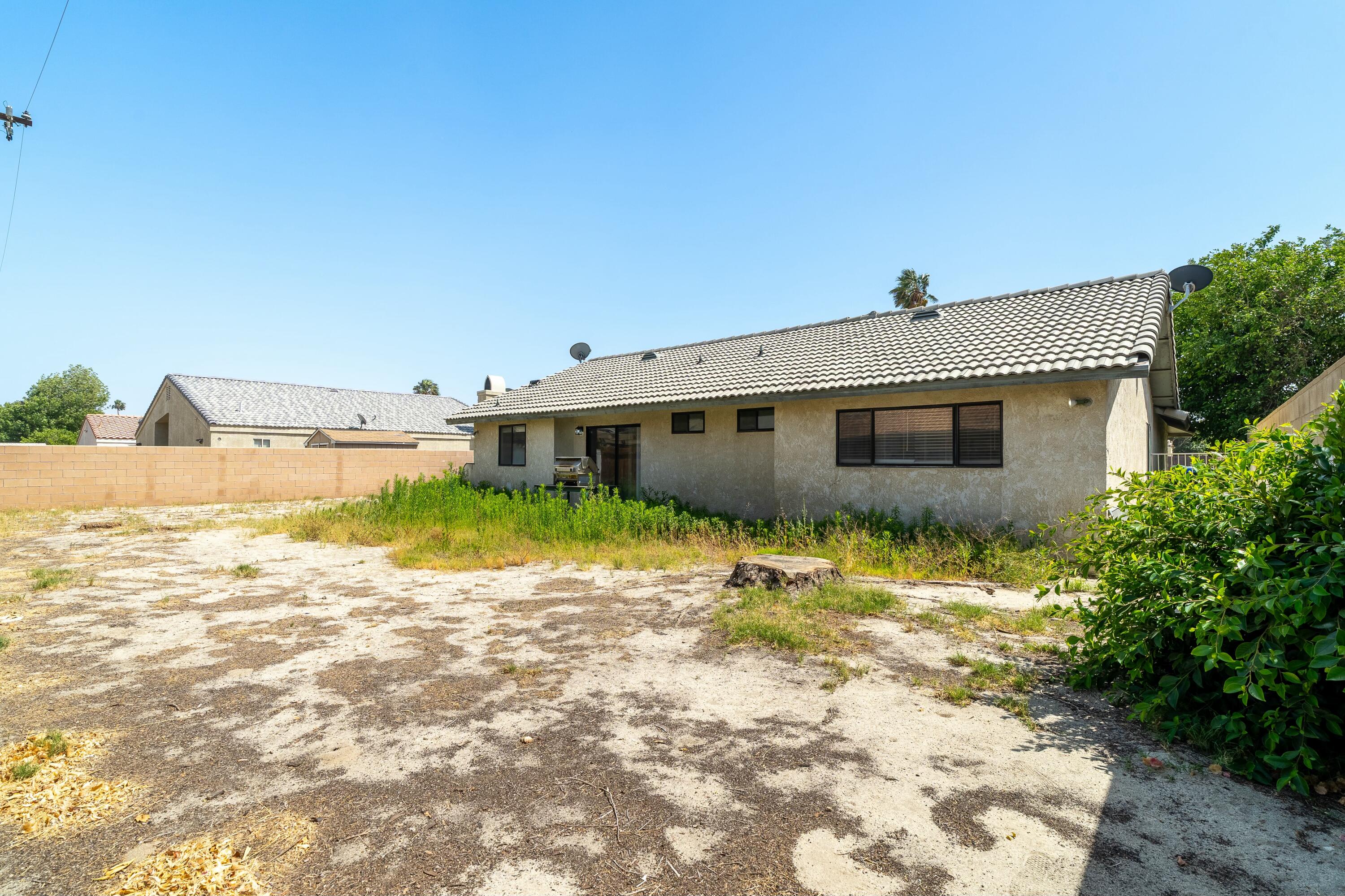 69290 El Dobe Road Cathedral City, CA 92234 - Photo 29 of 42 a front view of a house with a yard