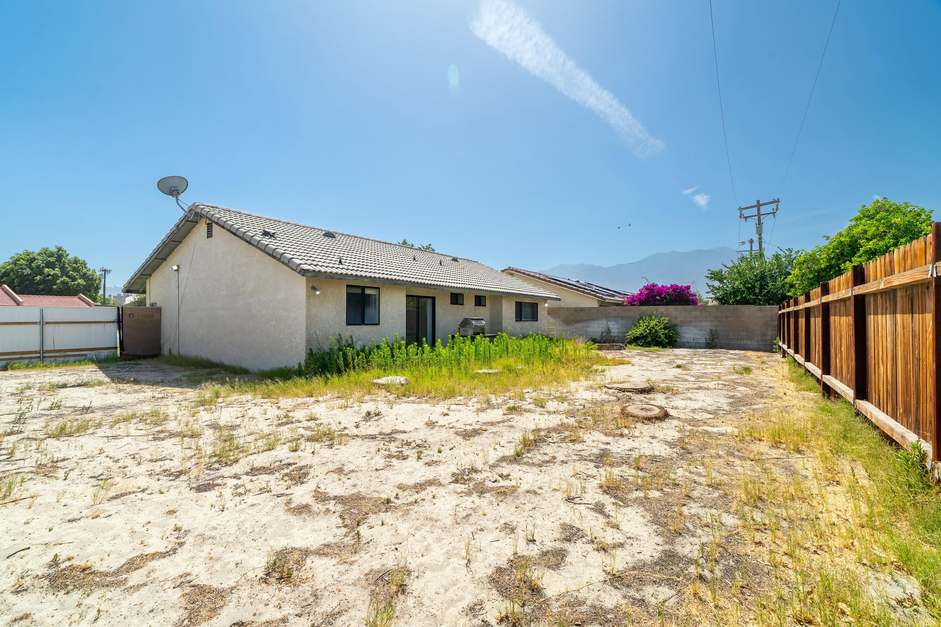69290 El Dobe Road Cathedral City, CA 92234 - Photo 30 of 42 a view of a house with backyard and garden