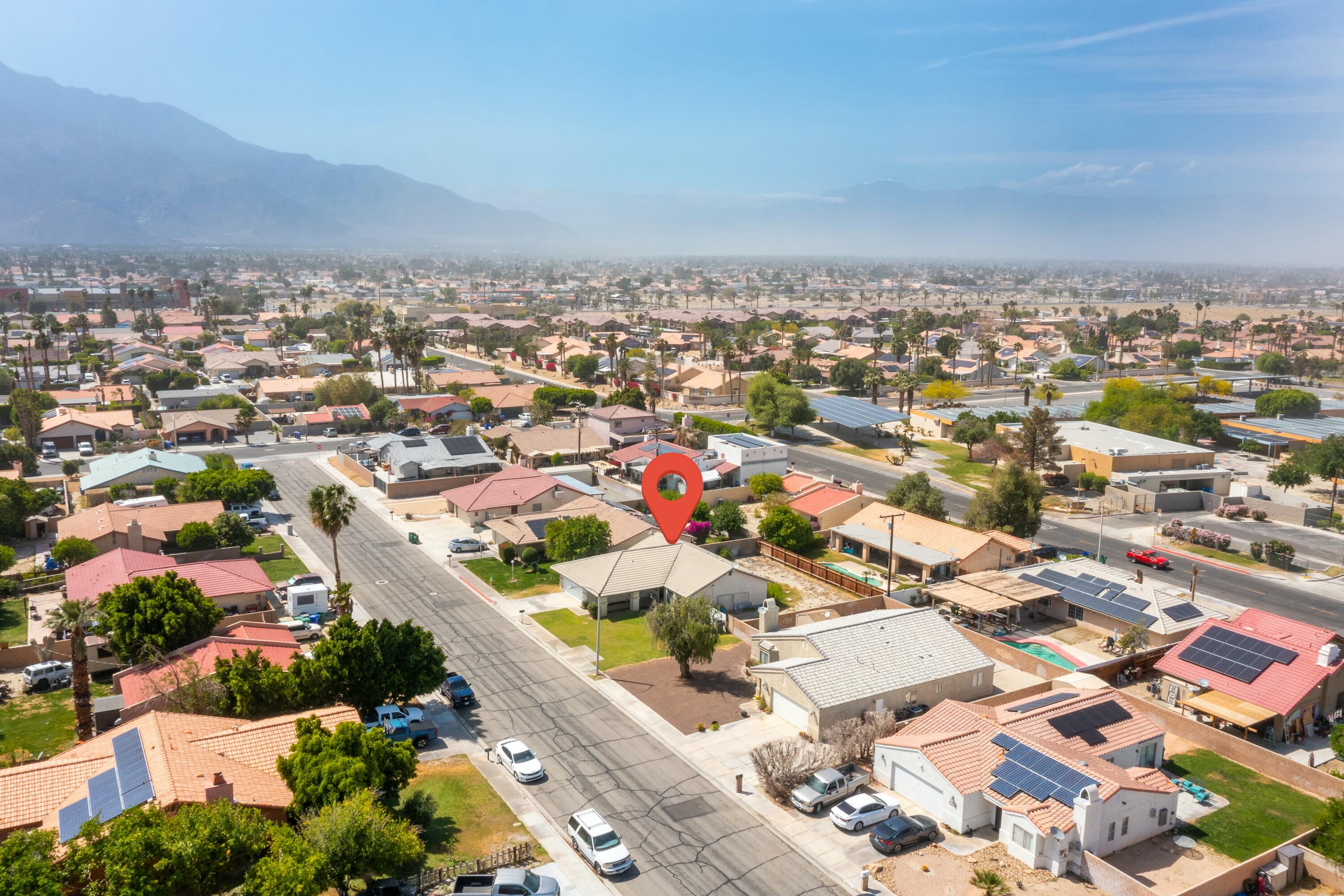 69290 El Dobe Road Cathedral City, CA 92234 - Photo 42 of 42 an aerial view of residential building with green space