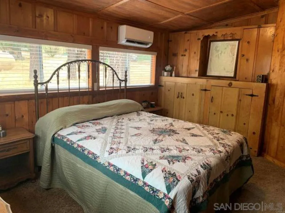 745 Boiling Springs Road Mount Laguna, CA 91948 - Photo 14 of 24 a bed sitting in a bedroom next to a window