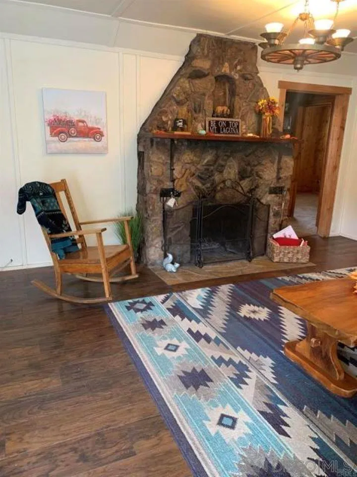 745 Boiling Springs Road Mount Laguna, CA 91948 - Photo 19 of 24 a living room with furniture and a fireplace