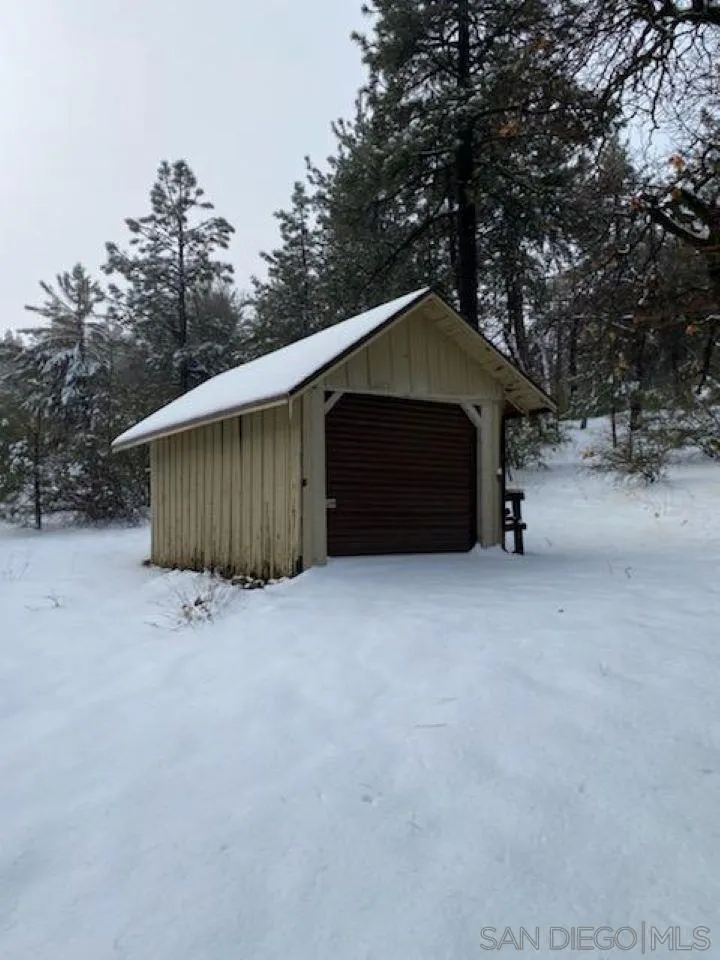 745 Boiling Springs Road Mount Laguna, CA 91948 - Photo 5 of 24 a wooden house with a outdoor space