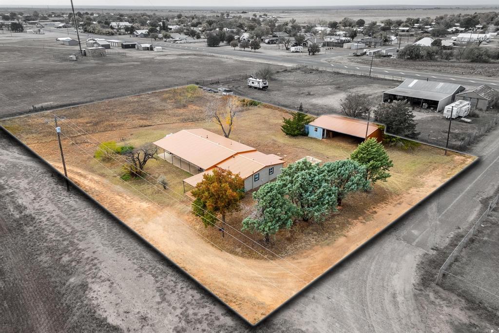 a view of a swimming pool with a yard