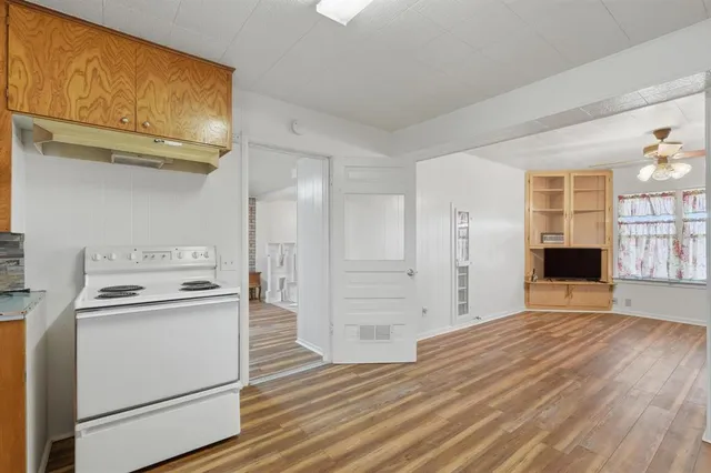 a view of kitchen with furniture and wooden floor