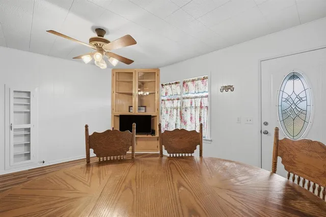 a view of a livingroom with furniture and a workspace