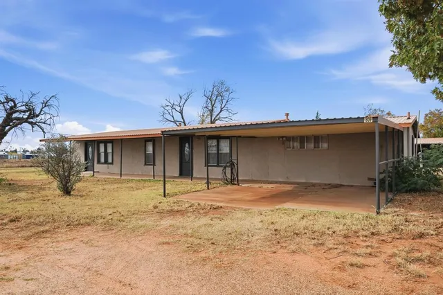 a house view with a backyard space