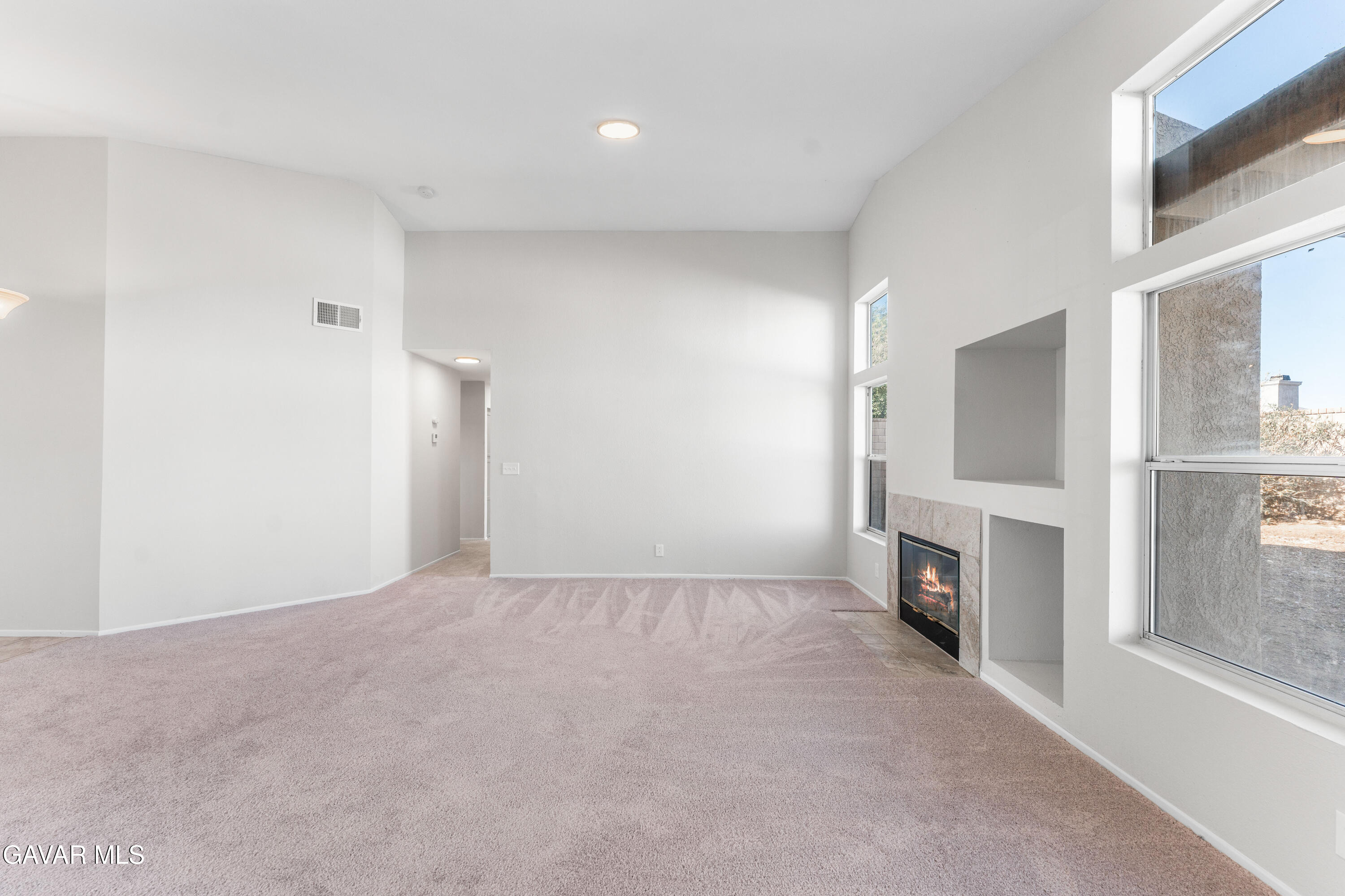 37031 Firethorn Street Palmdale, CA 93550 - Photo 11 of 36 a view of empty room with a fireplace