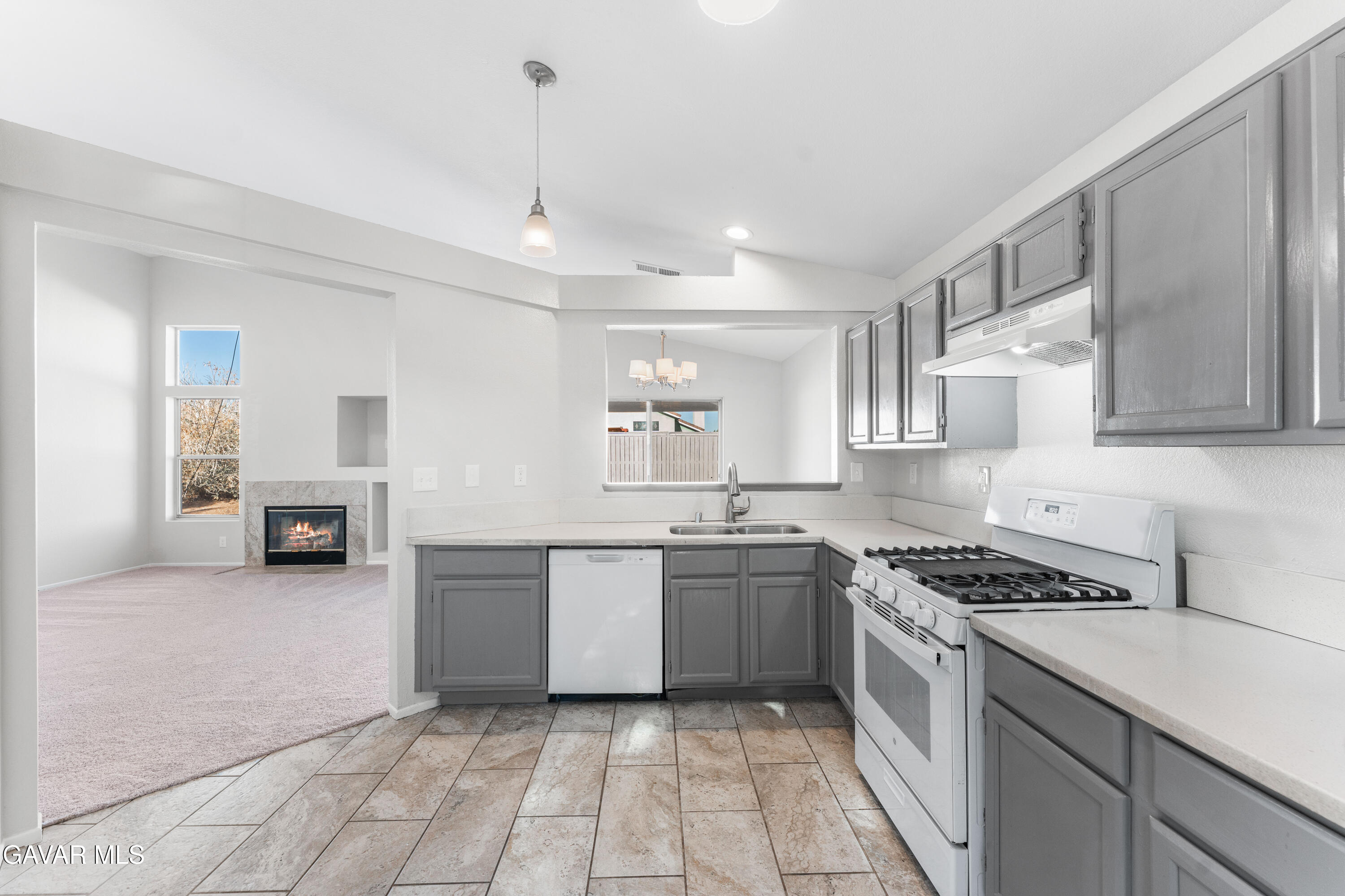 37031 Firethorn Street Palmdale, CA 93550 - Photo 17 of 36 a kitchen with stainless steel appliances granite countertop a sink and cabinets