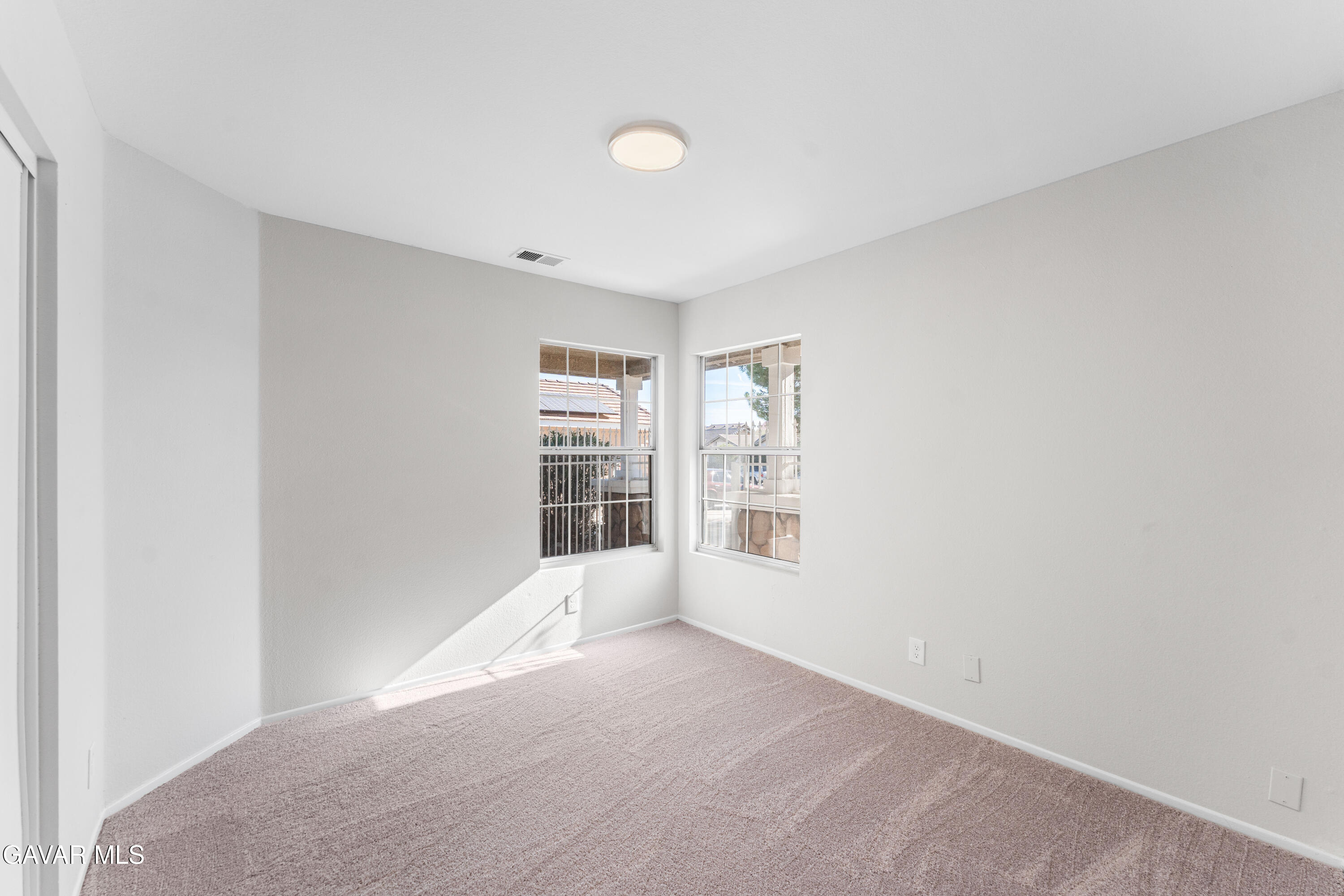 37031 Firethorn Street Palmdale, CA 93550 - Photo 19 of 36 a view of an empty room with a window