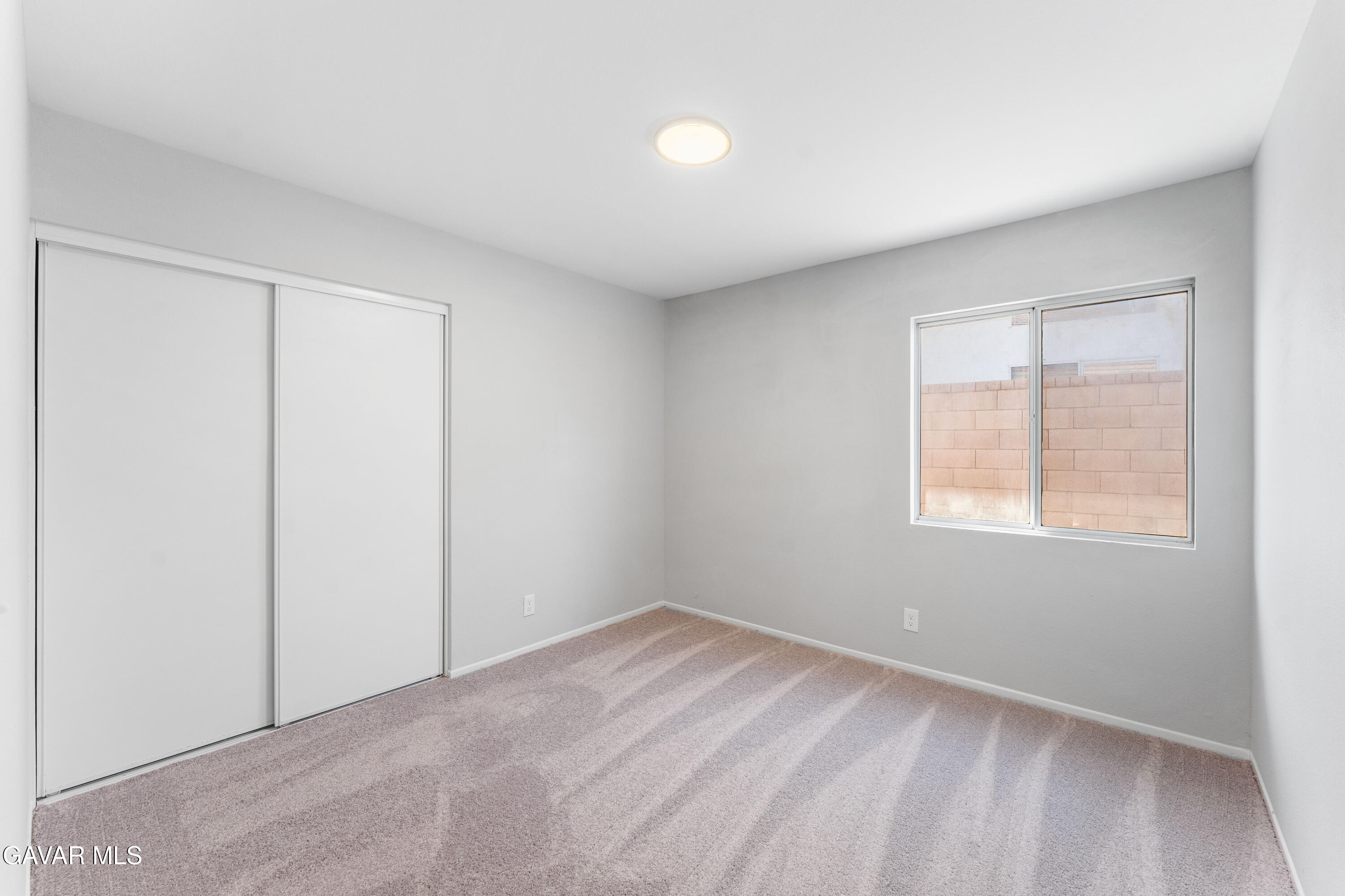 37031 Firethorn Street Palmdale, CA 93550 - Photo 21 of 36 an empty room with a window