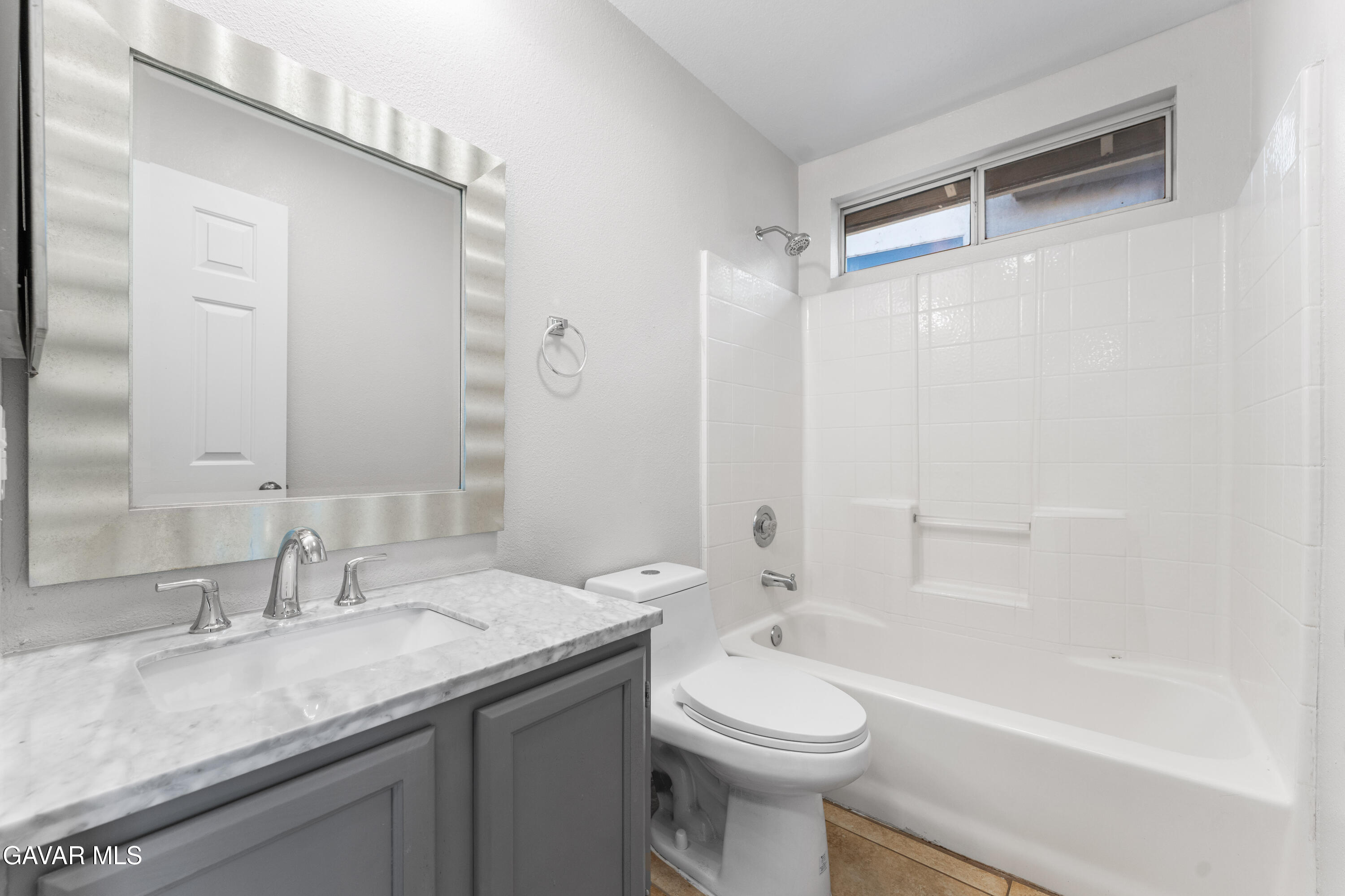 37031 Firethorn Street Palmdale, CA 93550 - Photo 23 of 36 a bathroom with a granite countertop sink toilet and shower