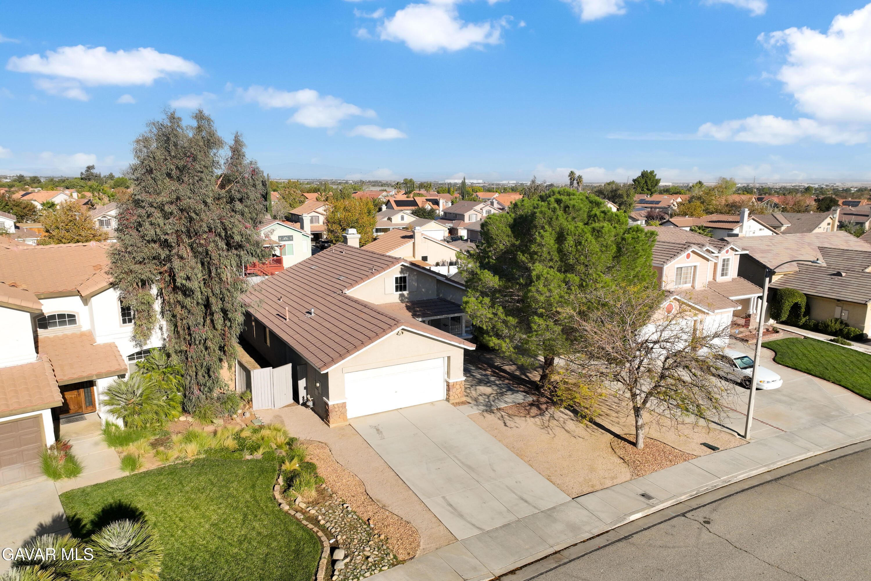 37031 Firethorn Street Palmdale, CA 93550 - Photo 34 of 36 an aerial view of a house with a yard and lake view
