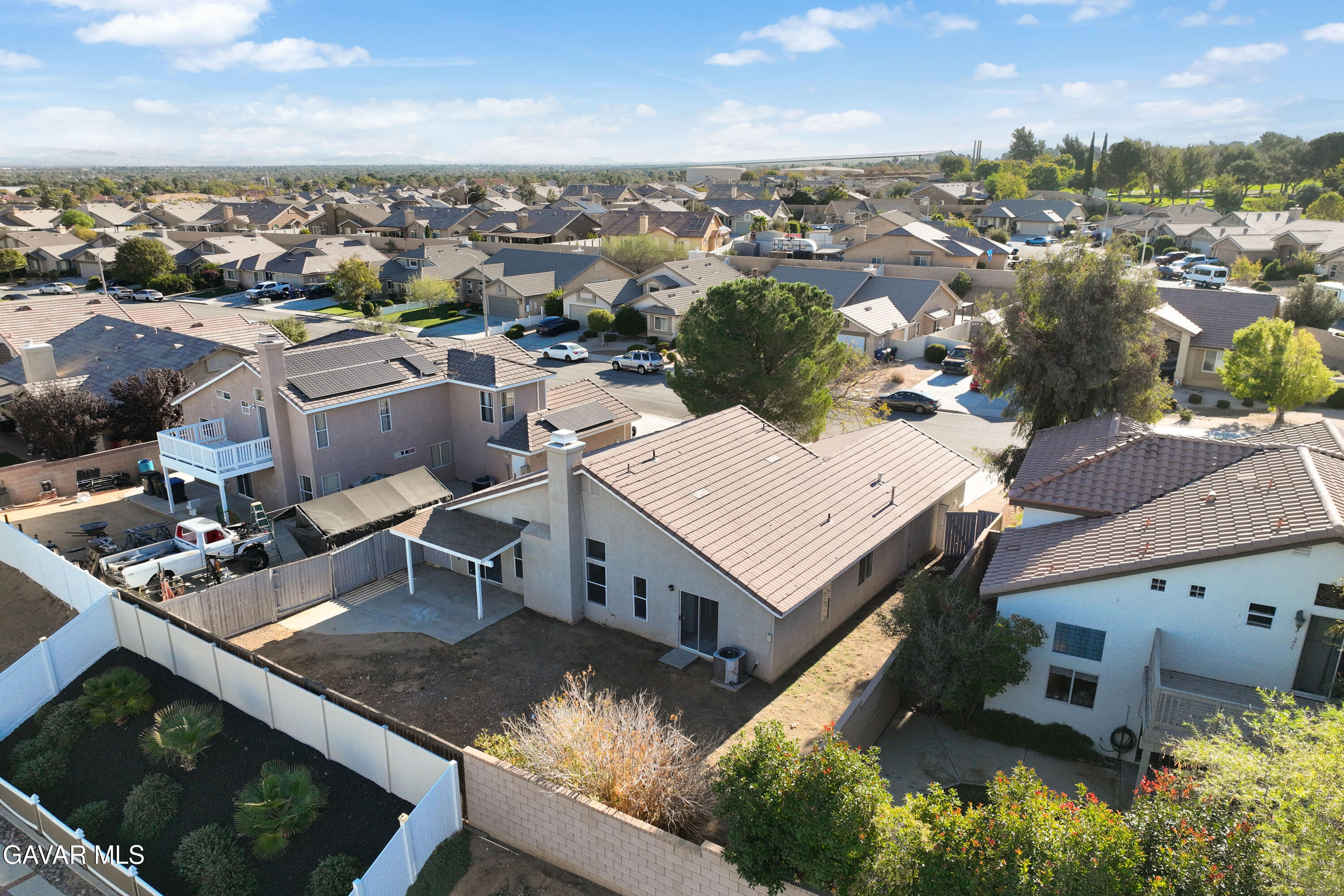37031 Firethorn Street Palmdale, CA 93550 - Photo 35 of 36 an aerial view of a house with swimming pool and mountains