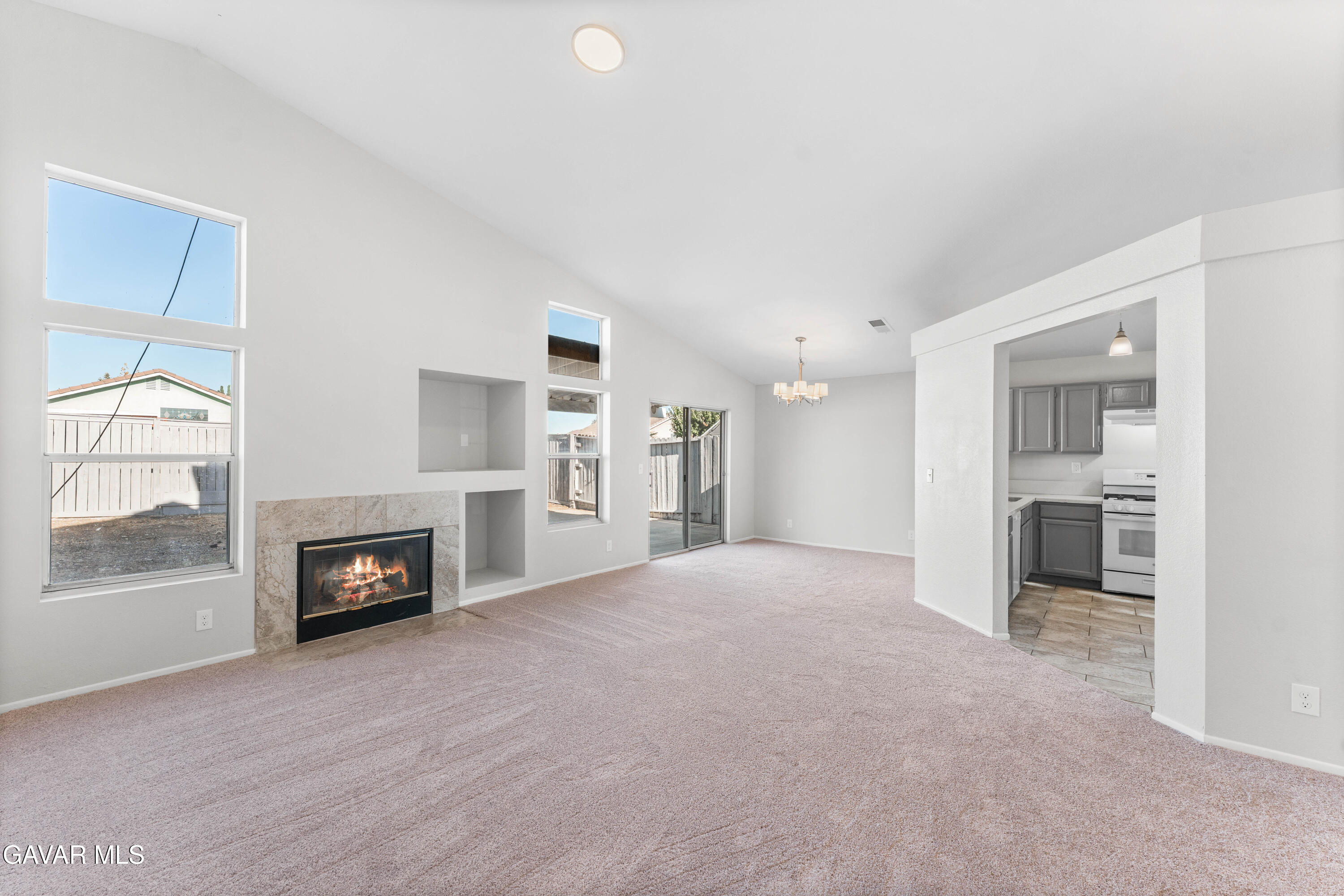 37031 Firethorn Street Palmdale, CA 93550 - Photo 8 of 36 a view of a livingroom with a fireplace and window