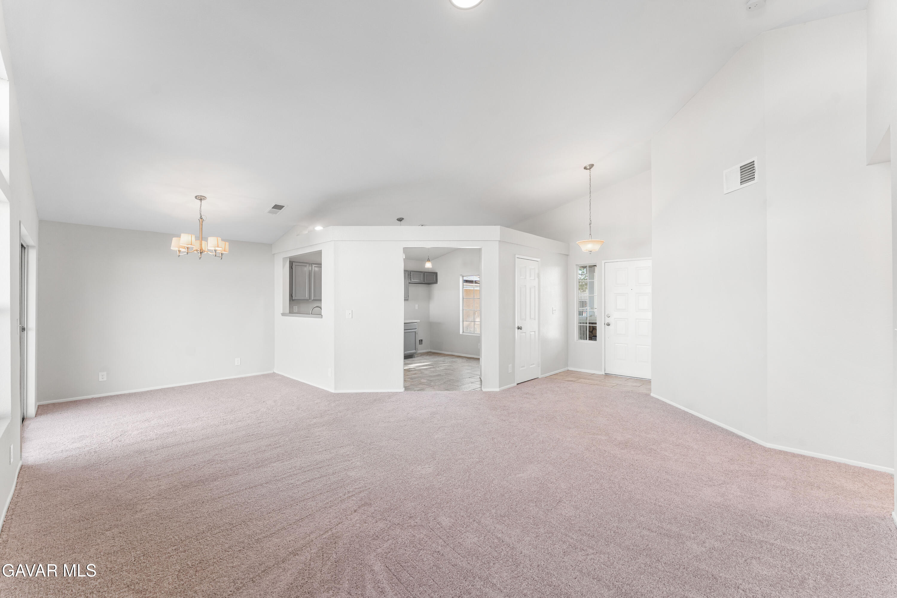 37031 Firethorn Street Palmdale, CA 93550 - Photo 9 of 36 a view of a big room with windows and cabinet