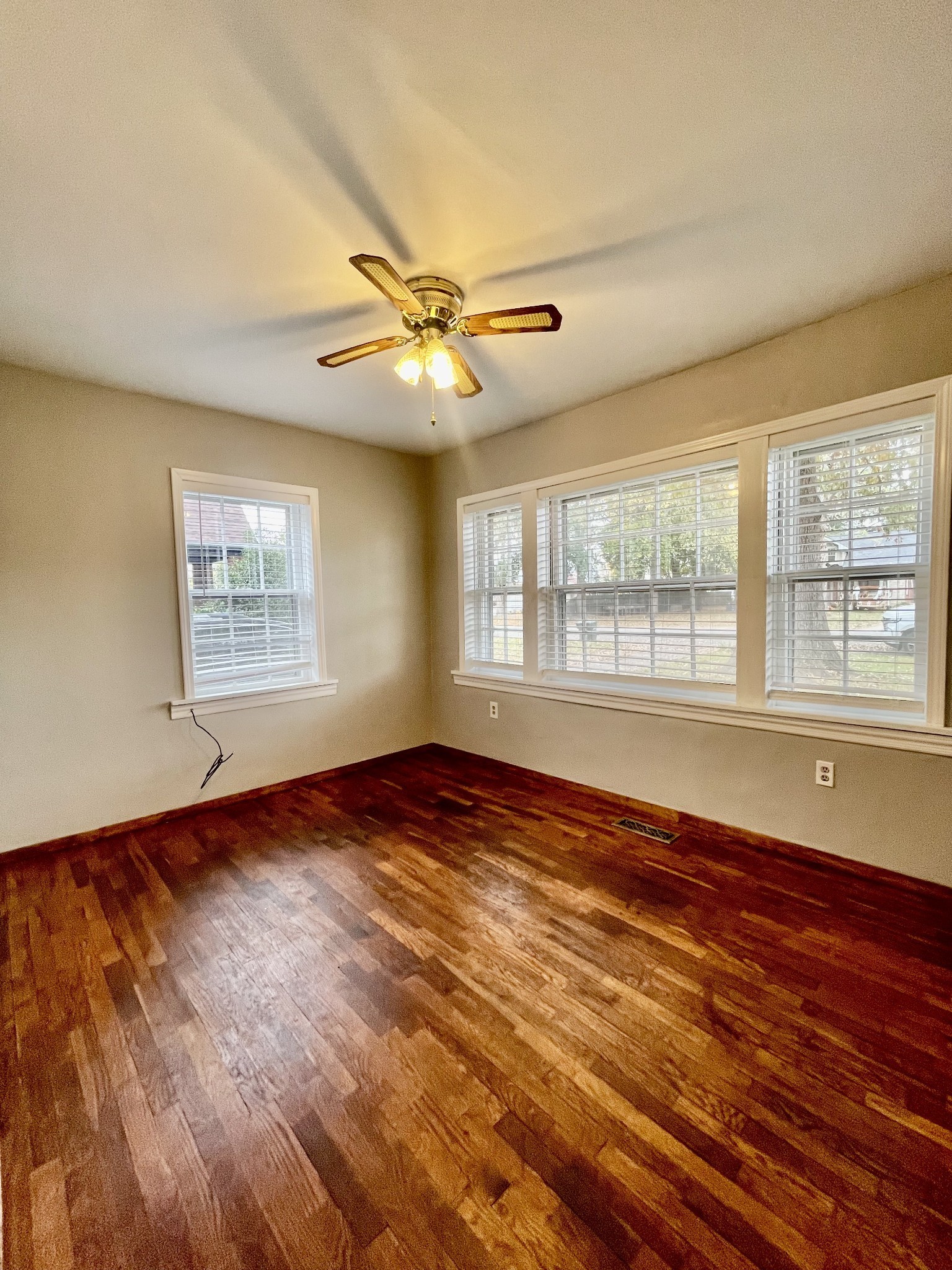 209 Frank Street Lawrenceburg, TN 38464 - Photo 24 of 34 a view of an empty room with wooden floor and a window