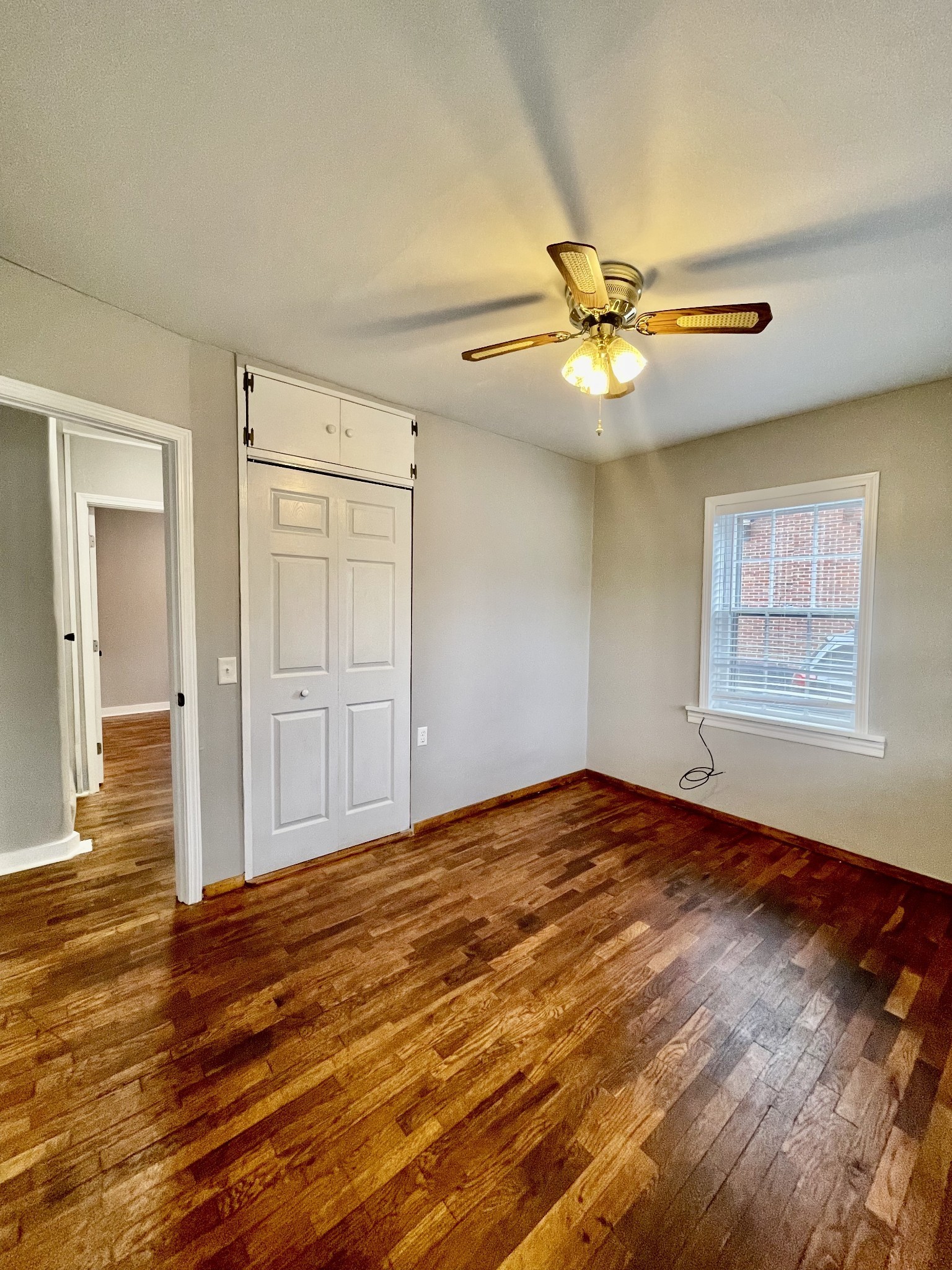 209 Frank Street Lawrenceburg, TN 38464 - Photo 25 of 34 wooden floor in an empty room with a window
