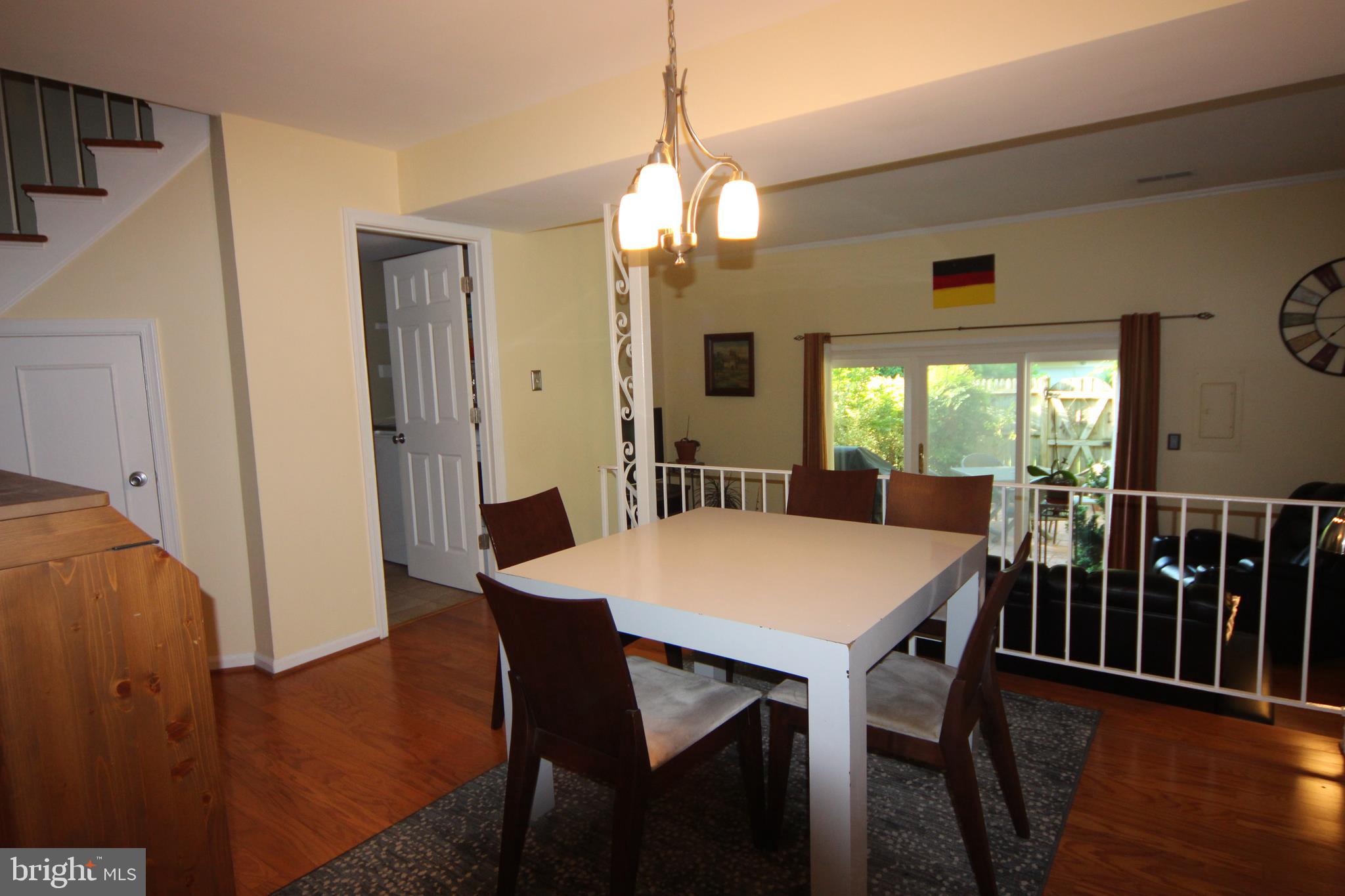 8220 Tory Road, Unit 144 Springfield, VA 22152 - Photo 8 of 27 Dining Room Overlooks Step Down Living Room
