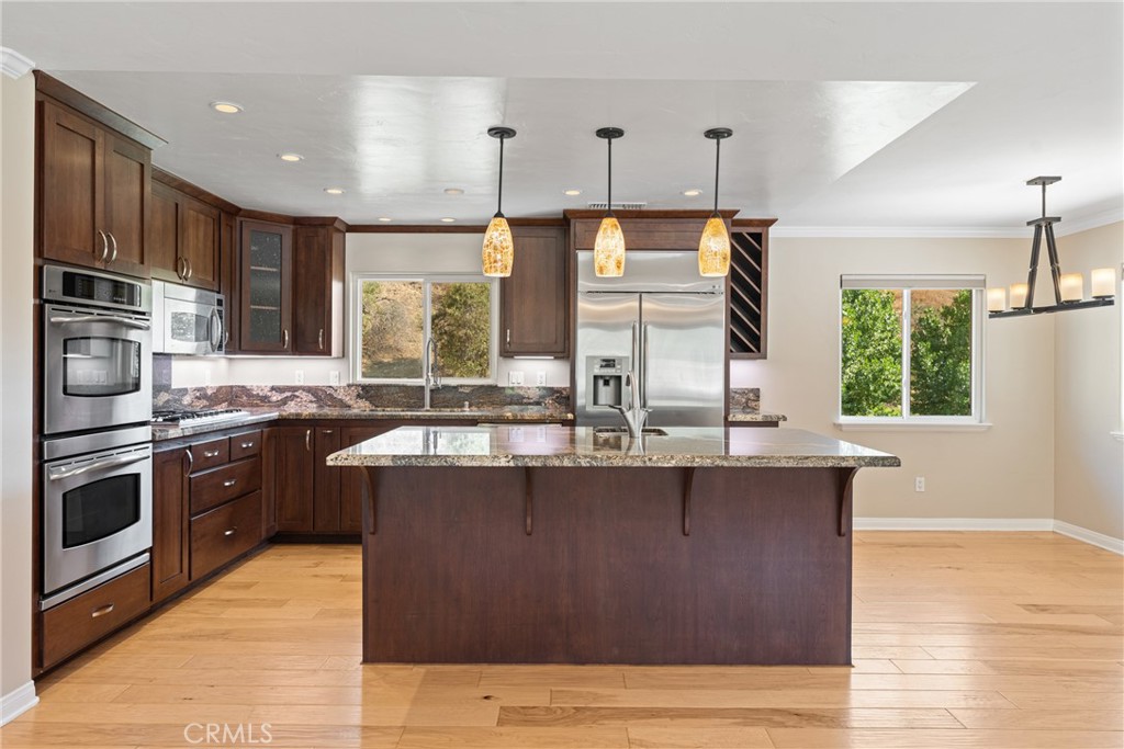 30300 Live Oak Canyon Road Redlands, CA 92373 - Photo 43 of 67 a kitchen with stainless steel appliances granite countertop a sink a stove and a refrigerator