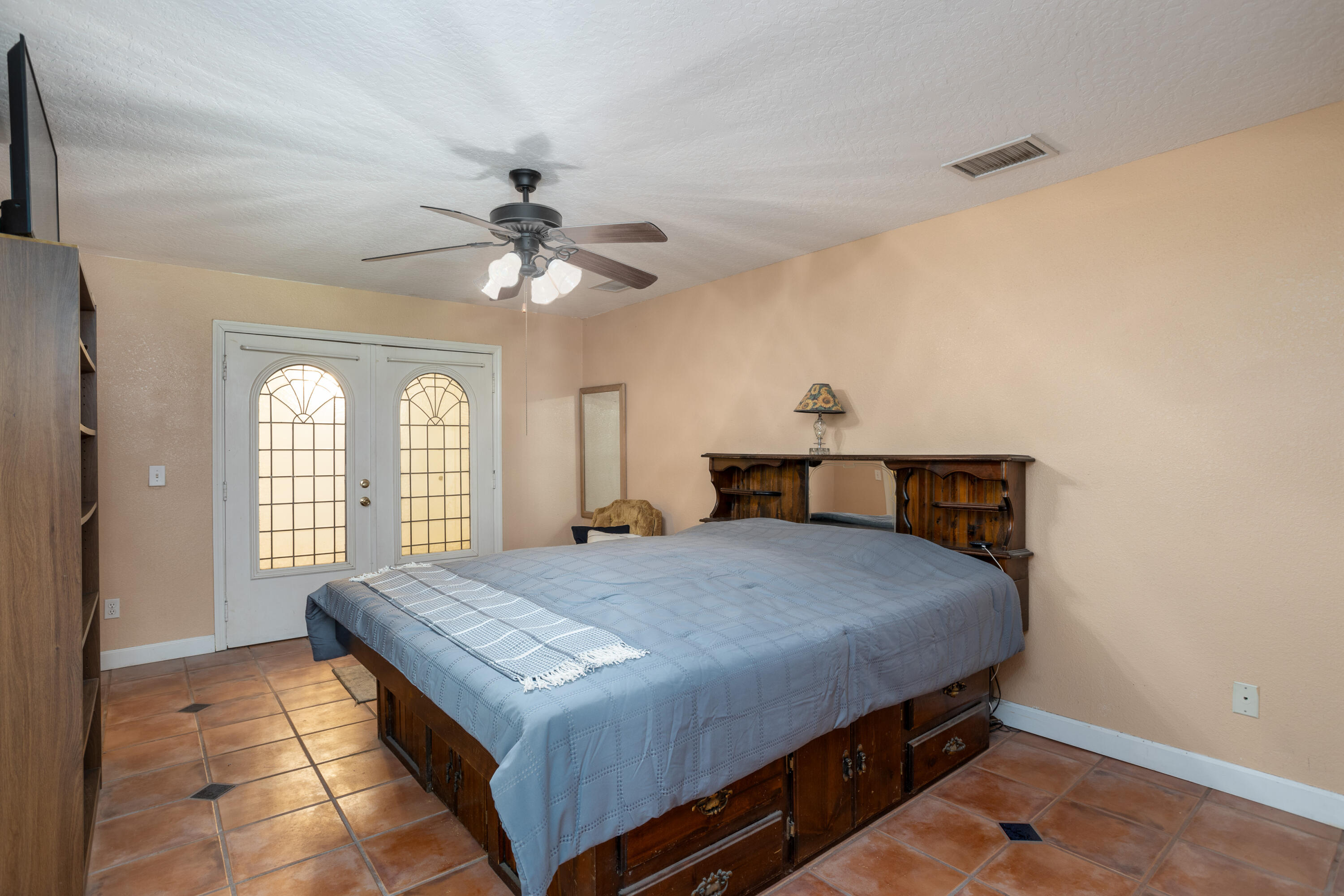 1280 Corey Road Malabar, FL 32950 - Photo 19 of 56 a bedroom with a bed and window