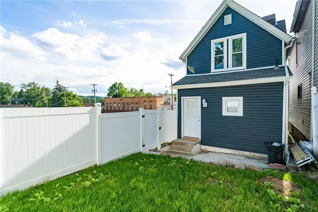 a backyard of a house with lots of green space