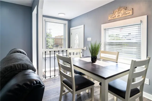 a view of a livingroom with furniture and a potted plant