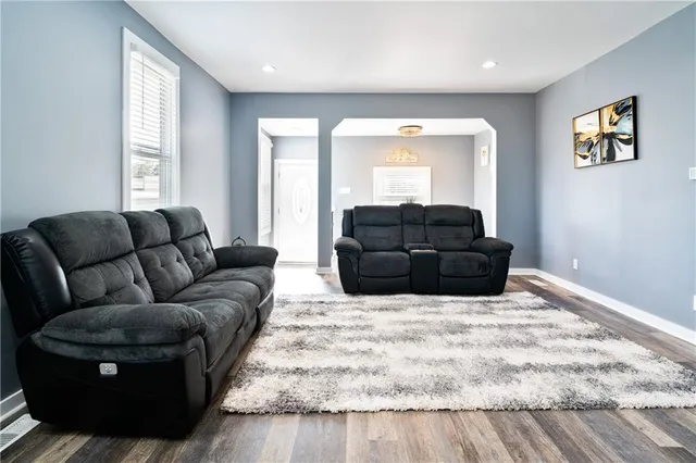 a living room with furniture window and couch