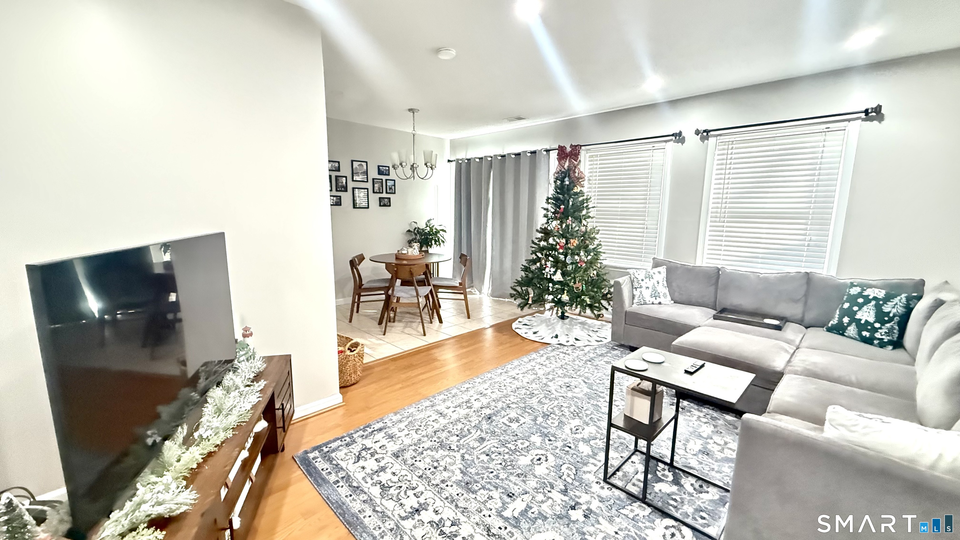 16 Maple Street, Unit 3 Vernon, CT 06066 - Photo 2 of 13 a living room with furniture and a flat screen tv