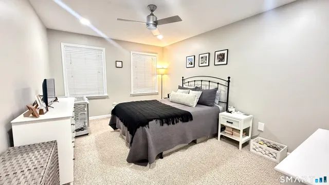 a bedroom with a bed and a chair