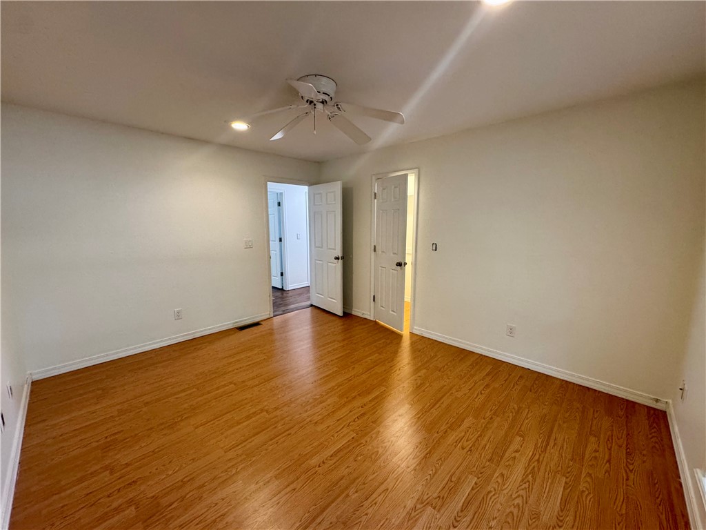 1197 Ridgeview Lane Russellville, AR 72802 - Photo 20 of 44 Room featuring wood-finish flooring, recessed lighting, a ceiling fan, and painted walls