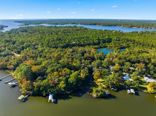 an aerial view of a houses with a yard