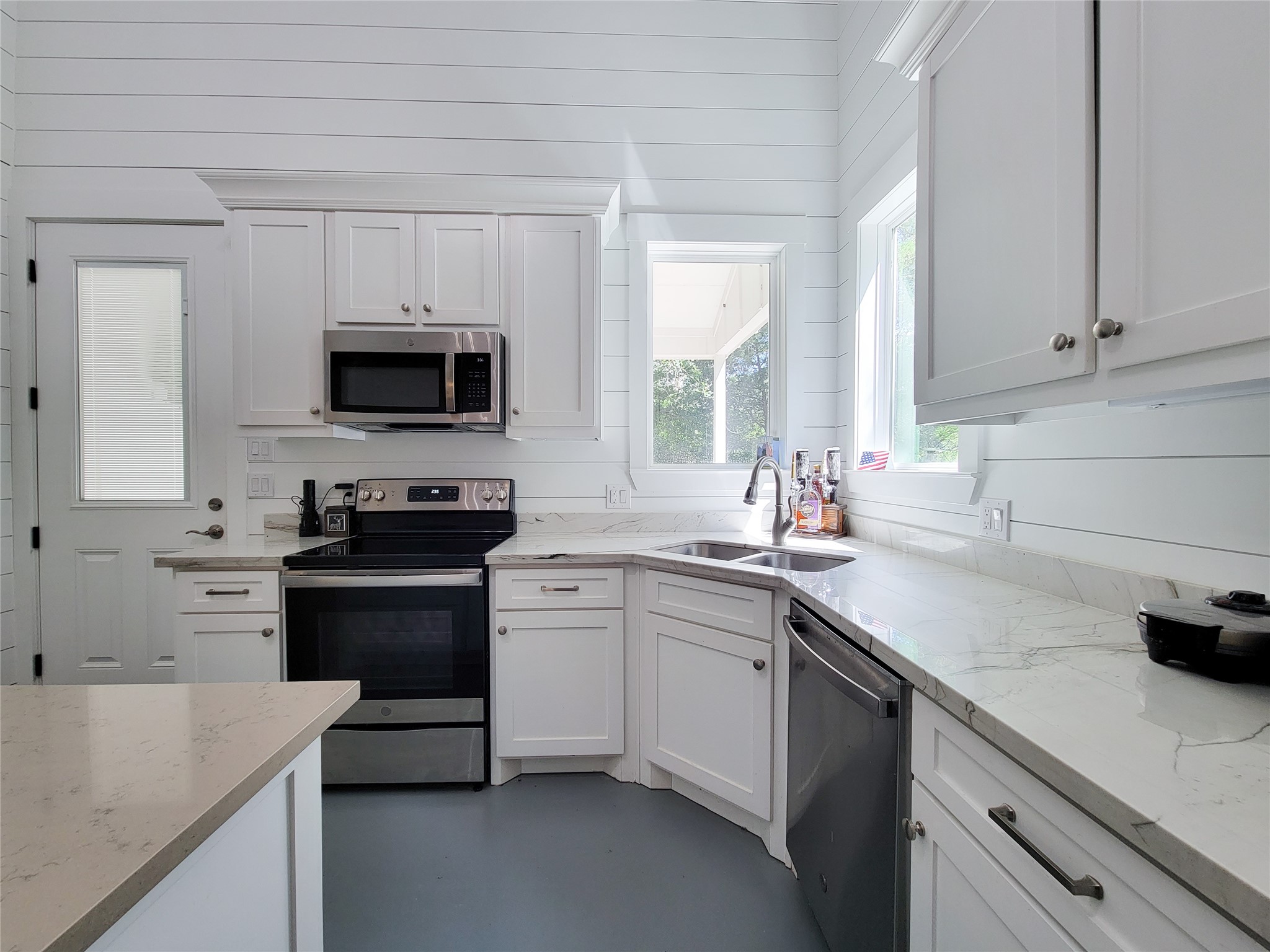 4937 Wolff Road Round Top, TX 78954 - Photo 14 of 31 Experience a bright kitchen with abundant natural light and elegant granite countertops.
