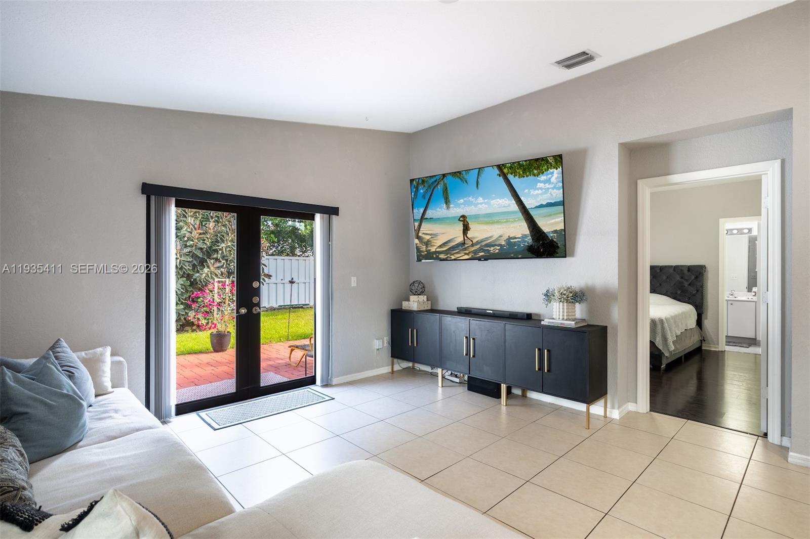 4521 Southwest 124th Terrace Miramar, FL 33027 - Photo 16 of 47 a living room with furniture and next to a window