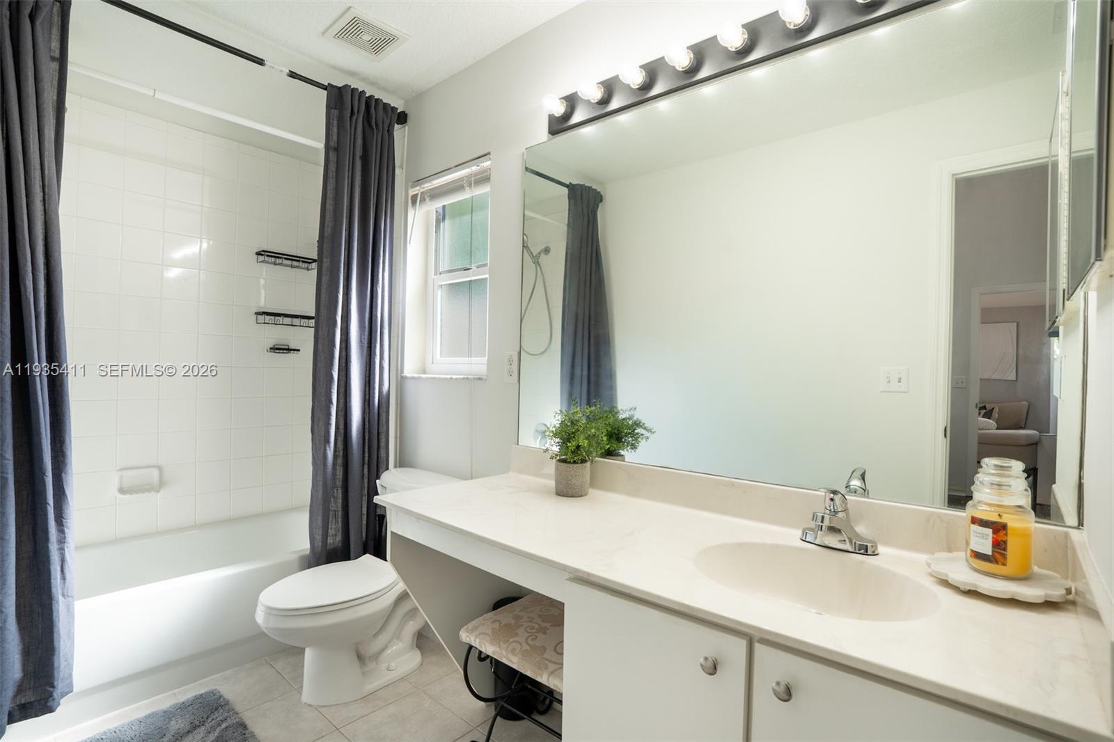 4521 Southwest 124th Terrace Miramar, FL 33027 - Photo 20 of 47 a bathroom with a sink a toilet and shower