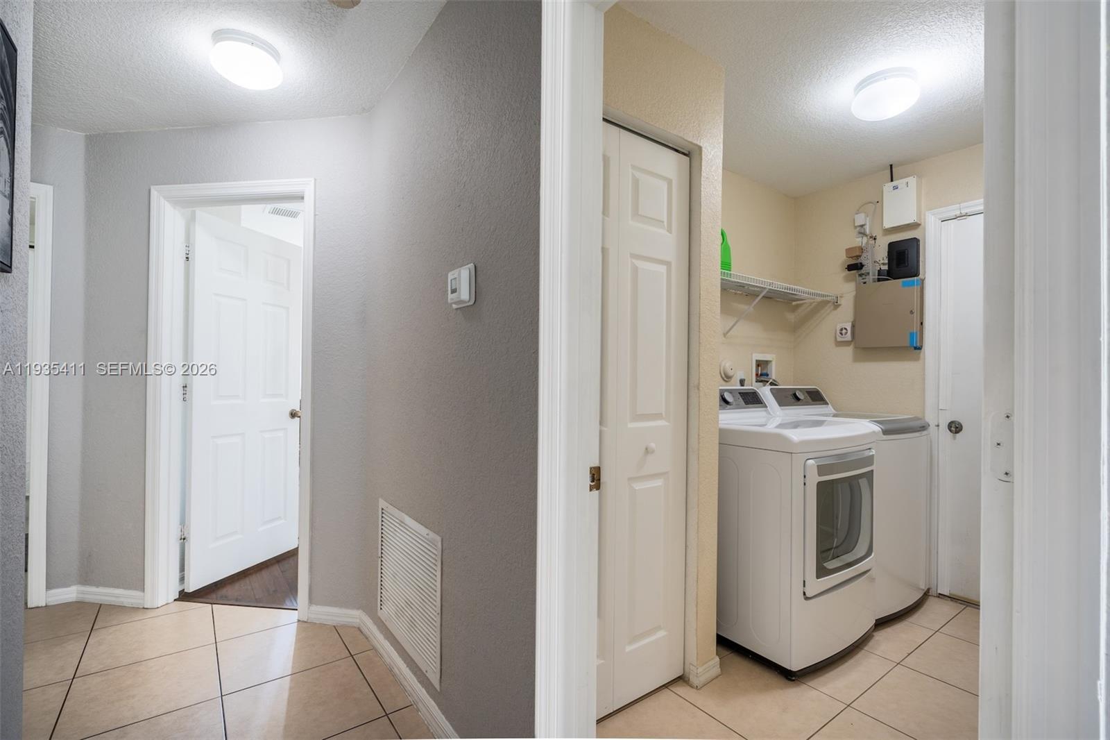 4521 Southwest 124th Terrace Miramar, FL 33027 - Photo 27 of 47 a view of a hallway with washer and dryer