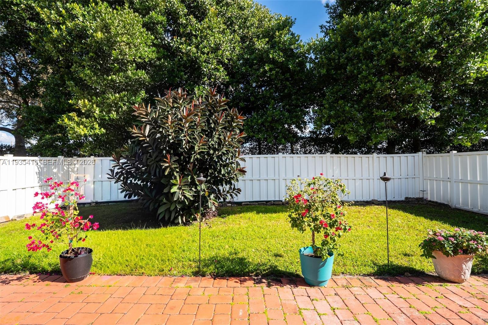 4521 Southwest 124th Terrace Miramar, FL 33027 - Photo 31 of 47 a view of garden with flowers and trees