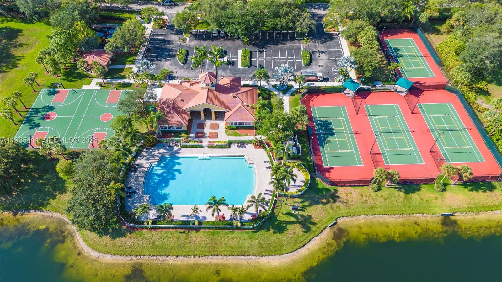 4521 Southwest 124th Terrace Miramar, FL 33027 - Photo 36 of 47 a view of swimming pool with a yard and seating area