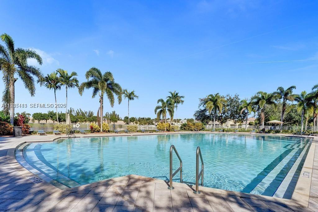 4521 Southwest 124th Terrace Miramar, FL 33027 - Photo 37 of 47 a view of a lake with palm trees