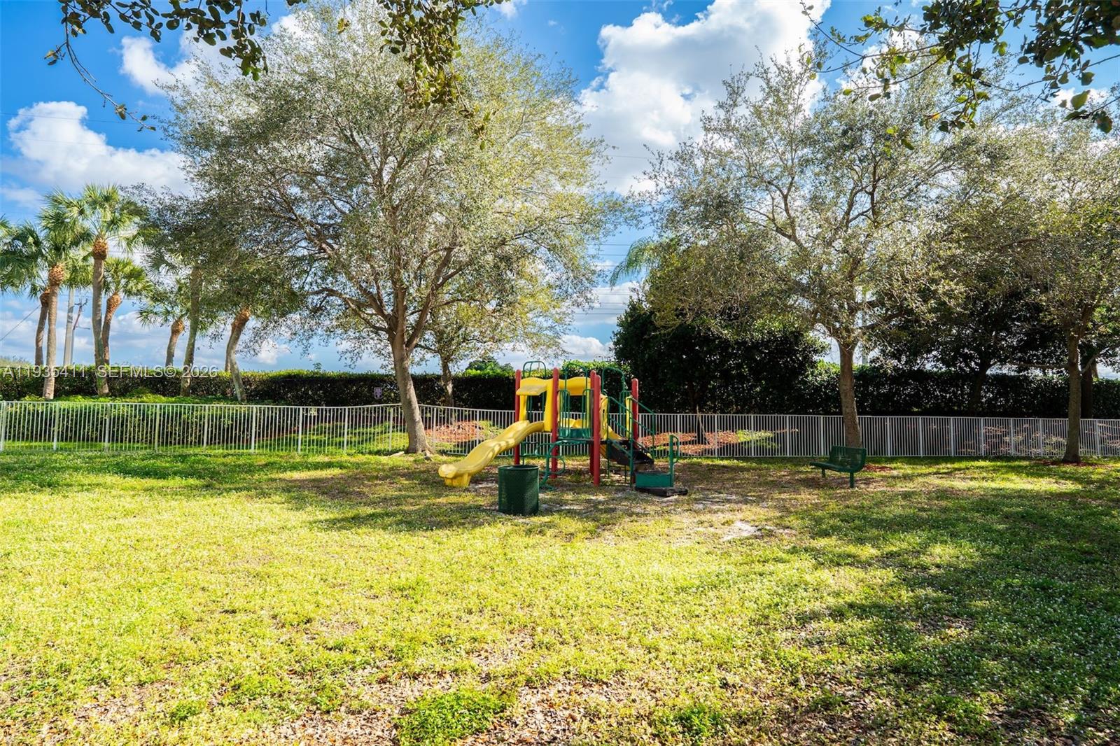 4521 Southwest 124th Terrace Miramar, FL 33027 - Photo 42 of 47 a view of a park with swings and slides