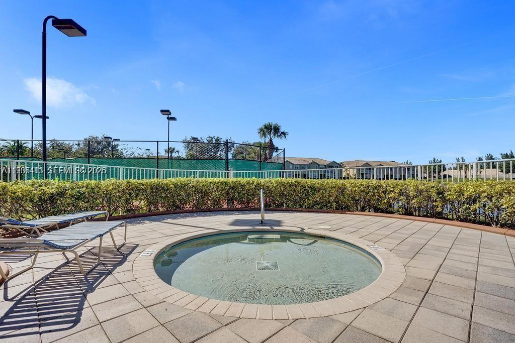 4521 Southwest 124th Terrace Miramar, FL 33027 - Photo 43 of 47 a view of a terrace with a bench