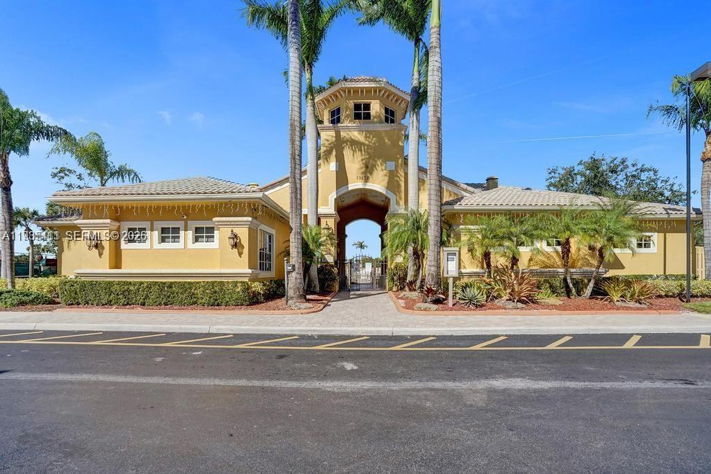 4521 Southwest 124th Terrace Miramar, FL 33027 - Photo 46 of 47 front view of a building with a street