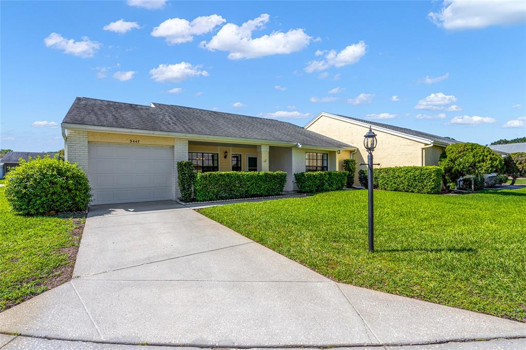 a view of house with backyard
